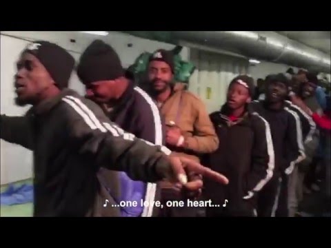 Rescued refugees on a rescue ship singing Bob Marley's One Love [12/24/2015]